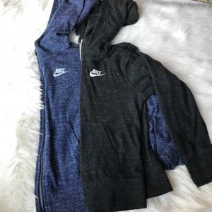 Two  blue and black Nike hoodies size large